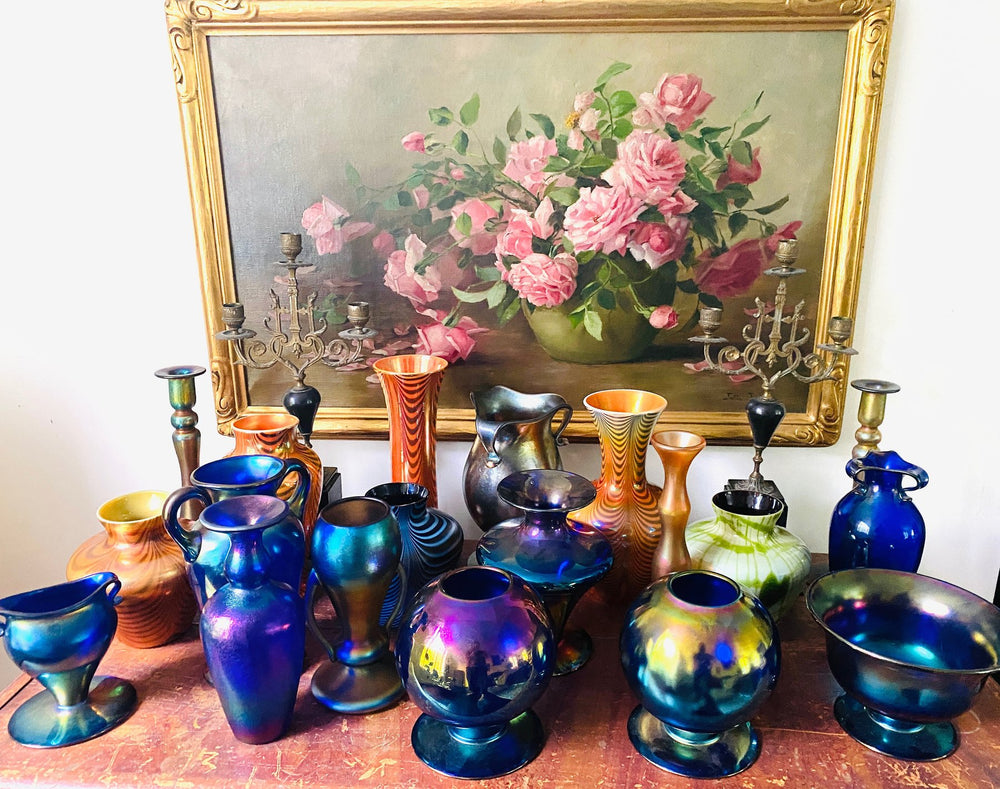 A collected grouping of antique art glass vases and vessels